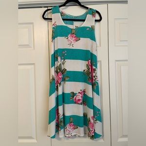 Women’s Boutique sundress. Cute bright stripe and floral design. Has pockets!